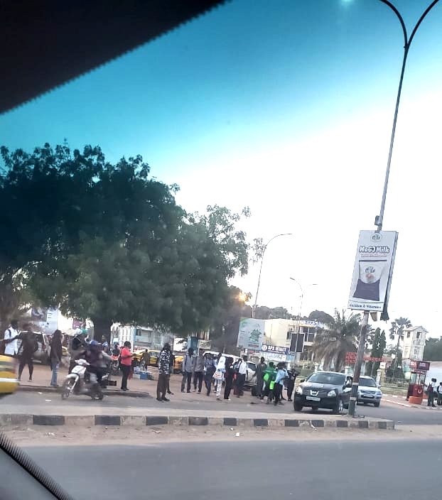 People waiting for transport in Banjul